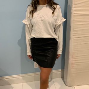 White sweater with ruffle detailing